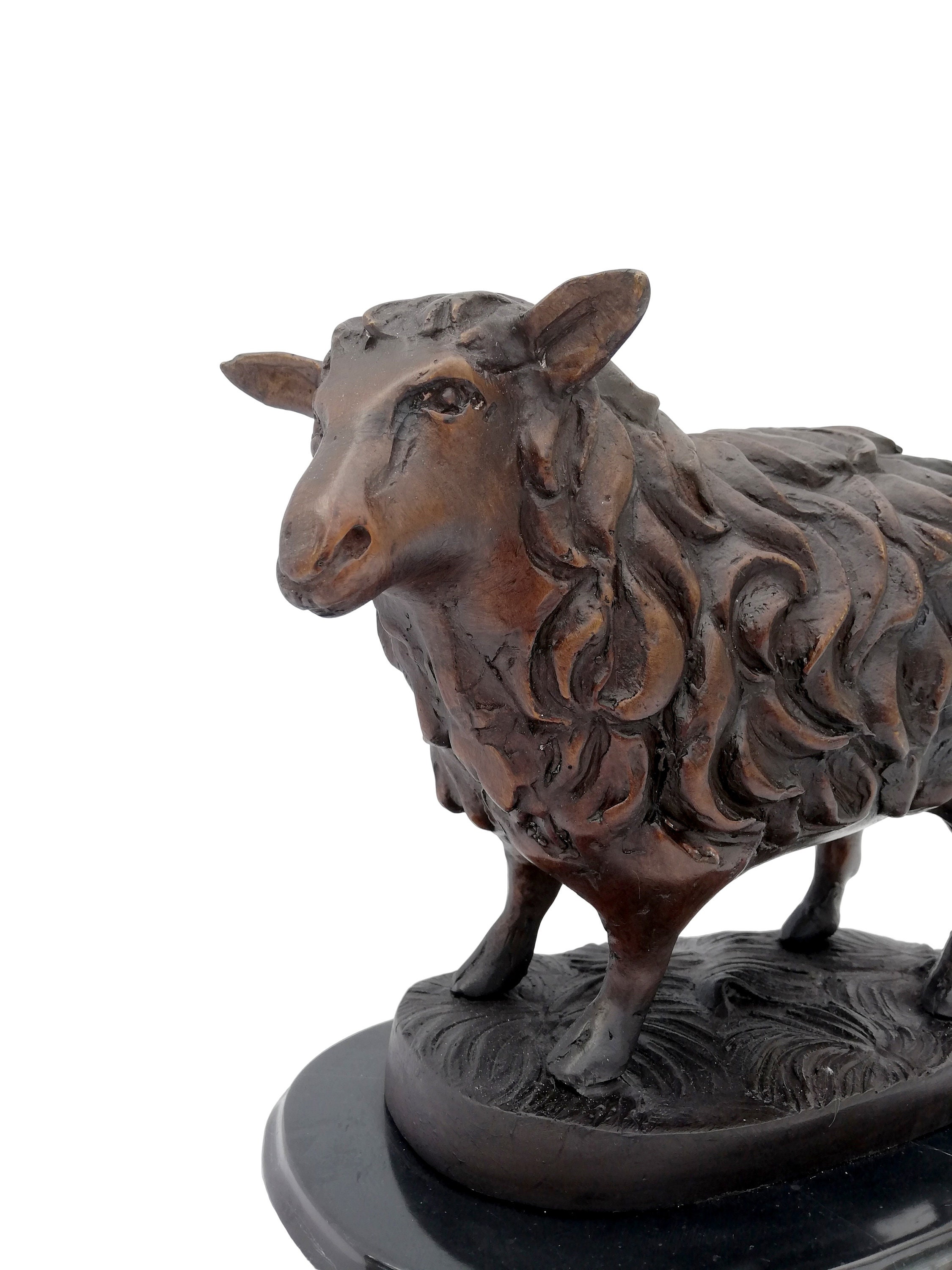 Bronze sheep sculpture on marble base