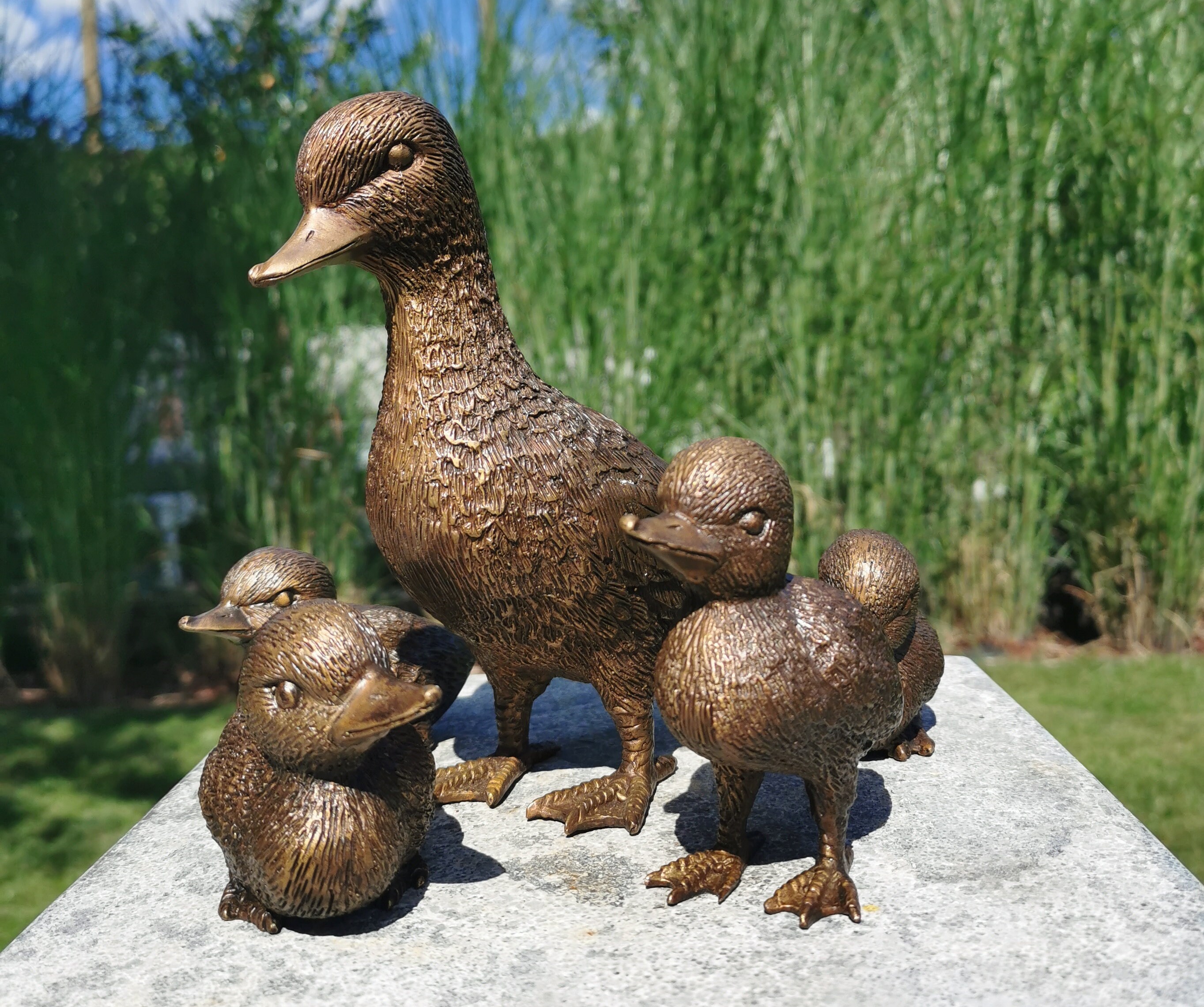 Bronze duck family Lovely garden decor Mother duck with ducklings