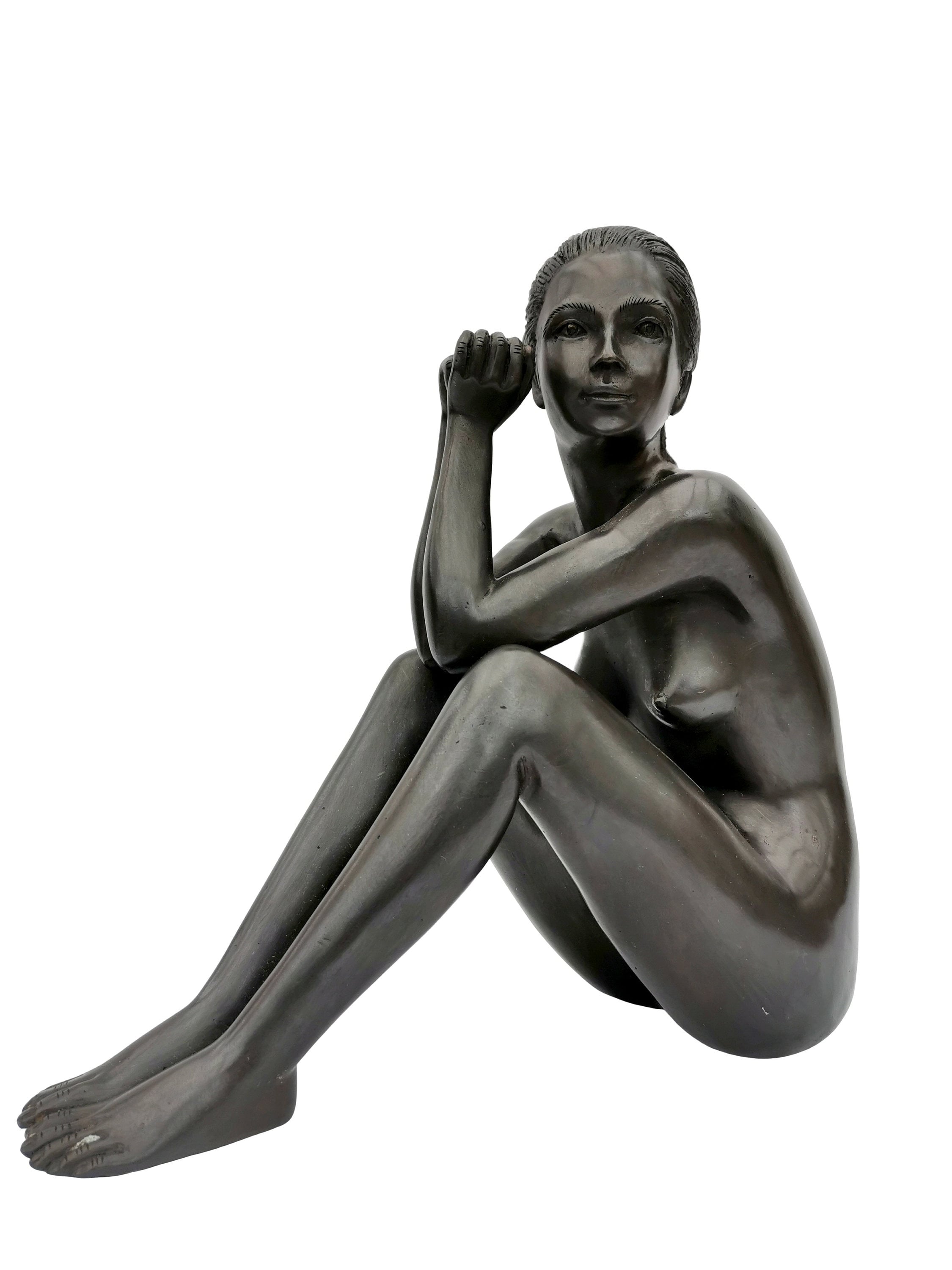 Bronze sculpture of a sitting woman