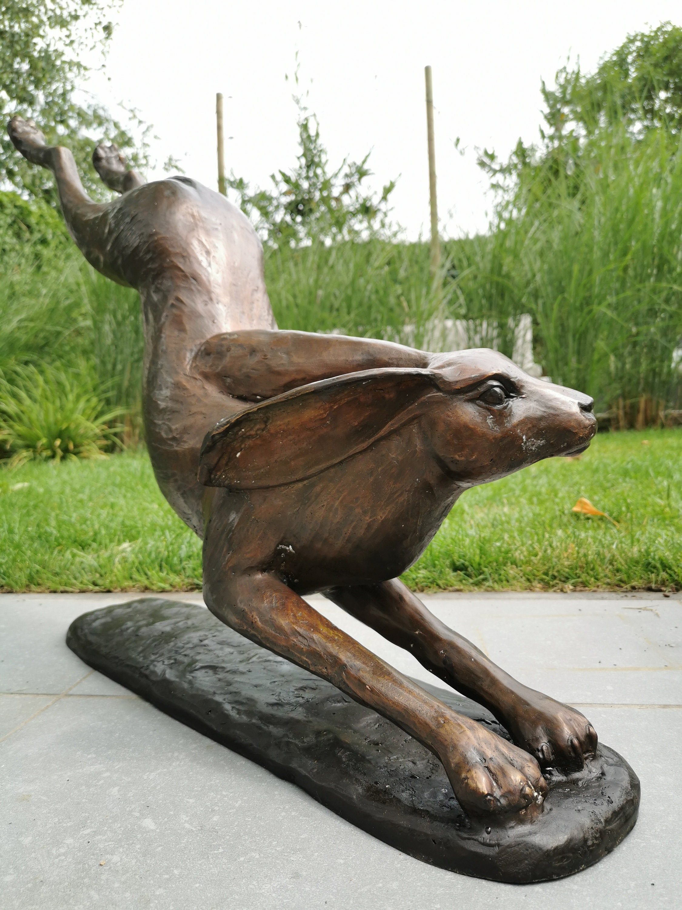 Huge bronze sculpture of a hare Bronze garden decor Lawn art