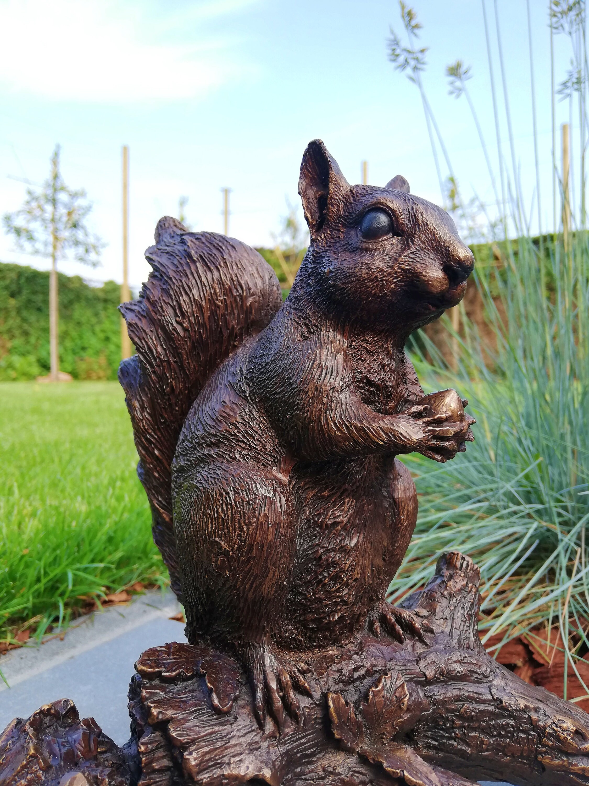 Bronze sculpture of a squirrel on a stump Garden decor Bronze porch