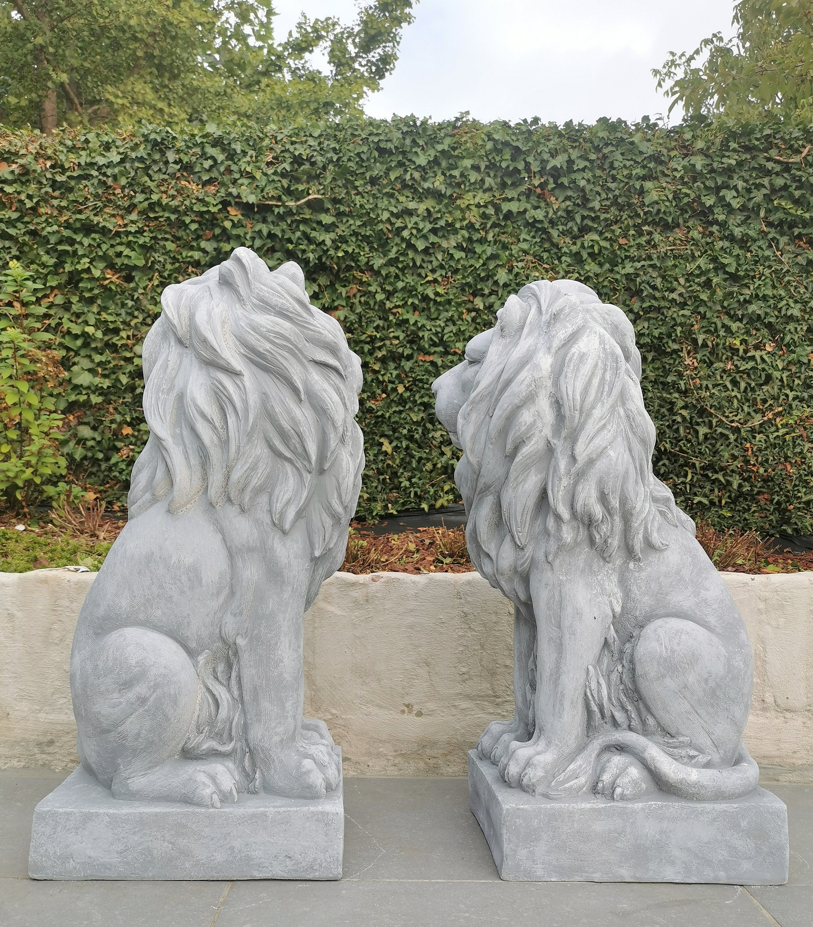 A couple of lion sculptures Good fir for outdoor & entrance