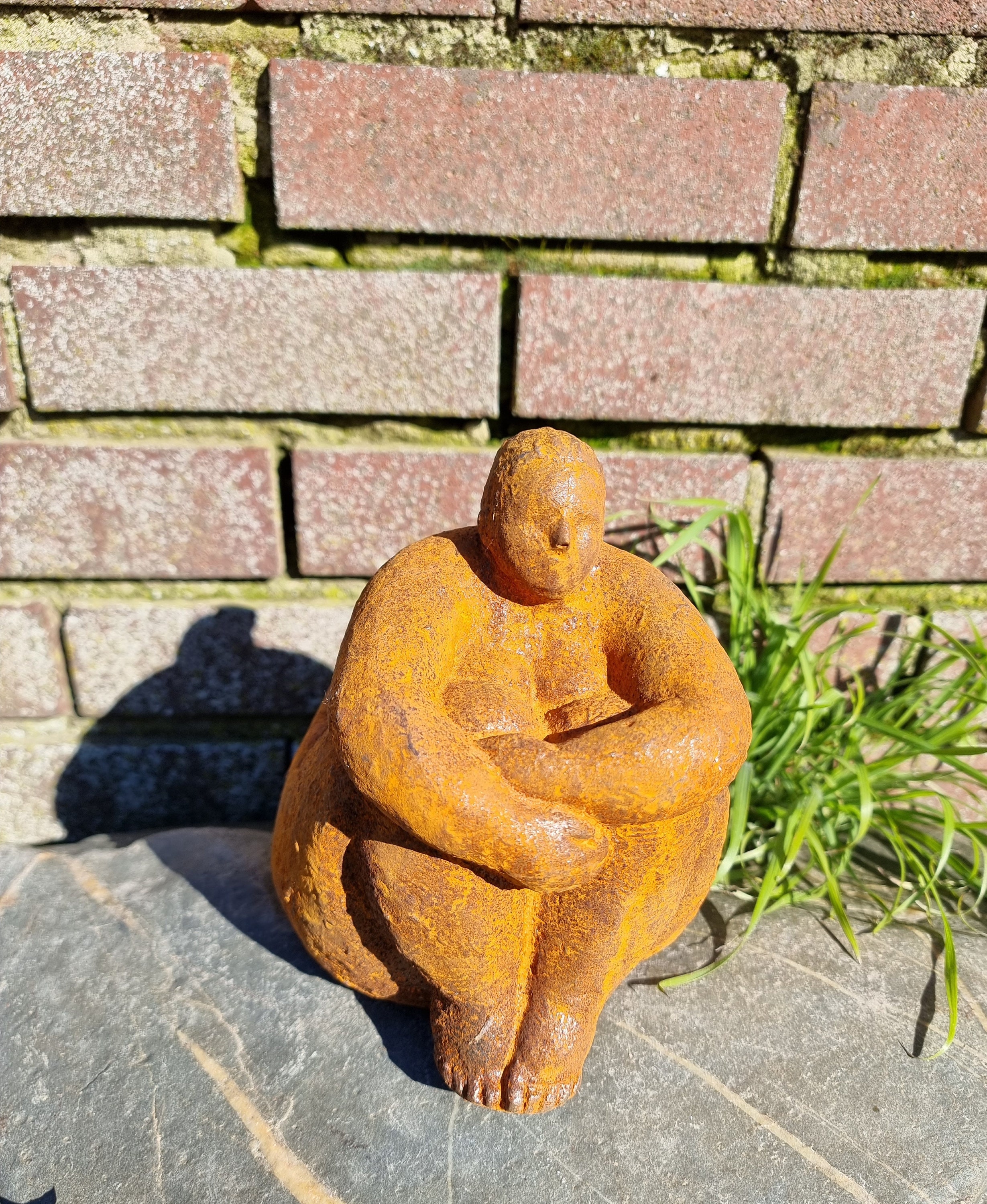 Sculpture of a dreaming lady Garden sculpture