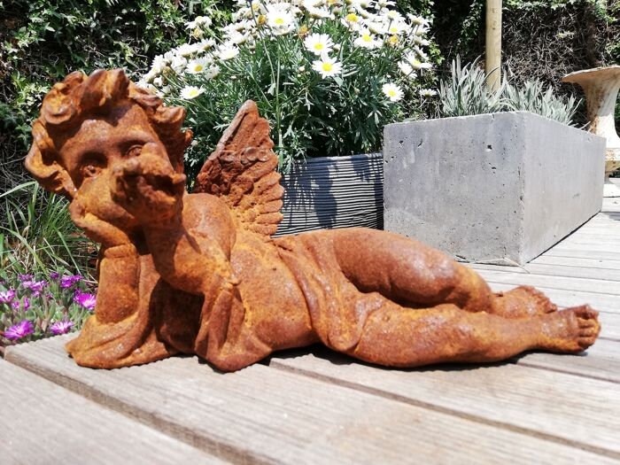 Antique garden sculpture of an Angel (boy)