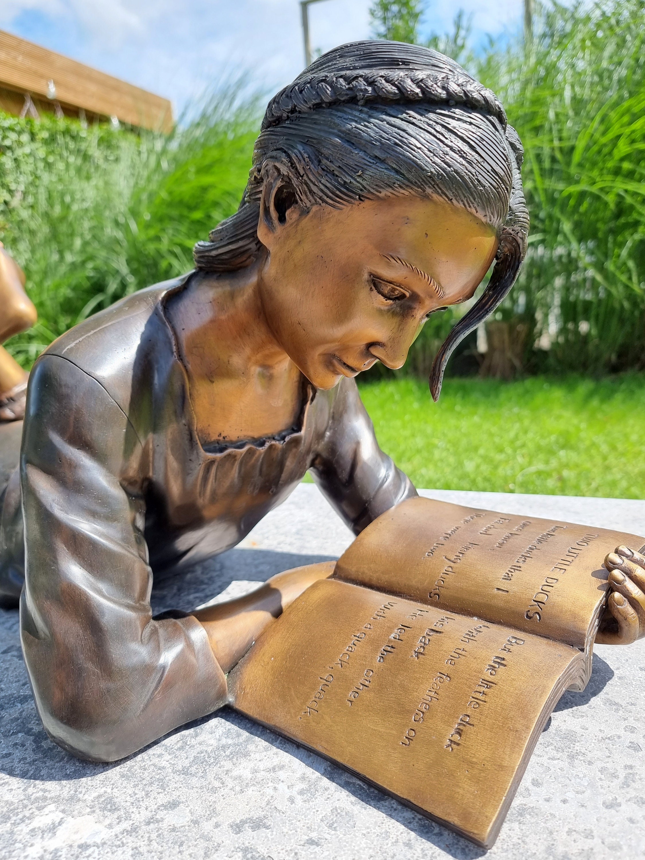 Bronze garden sculpture Girl reading a book Bronze children