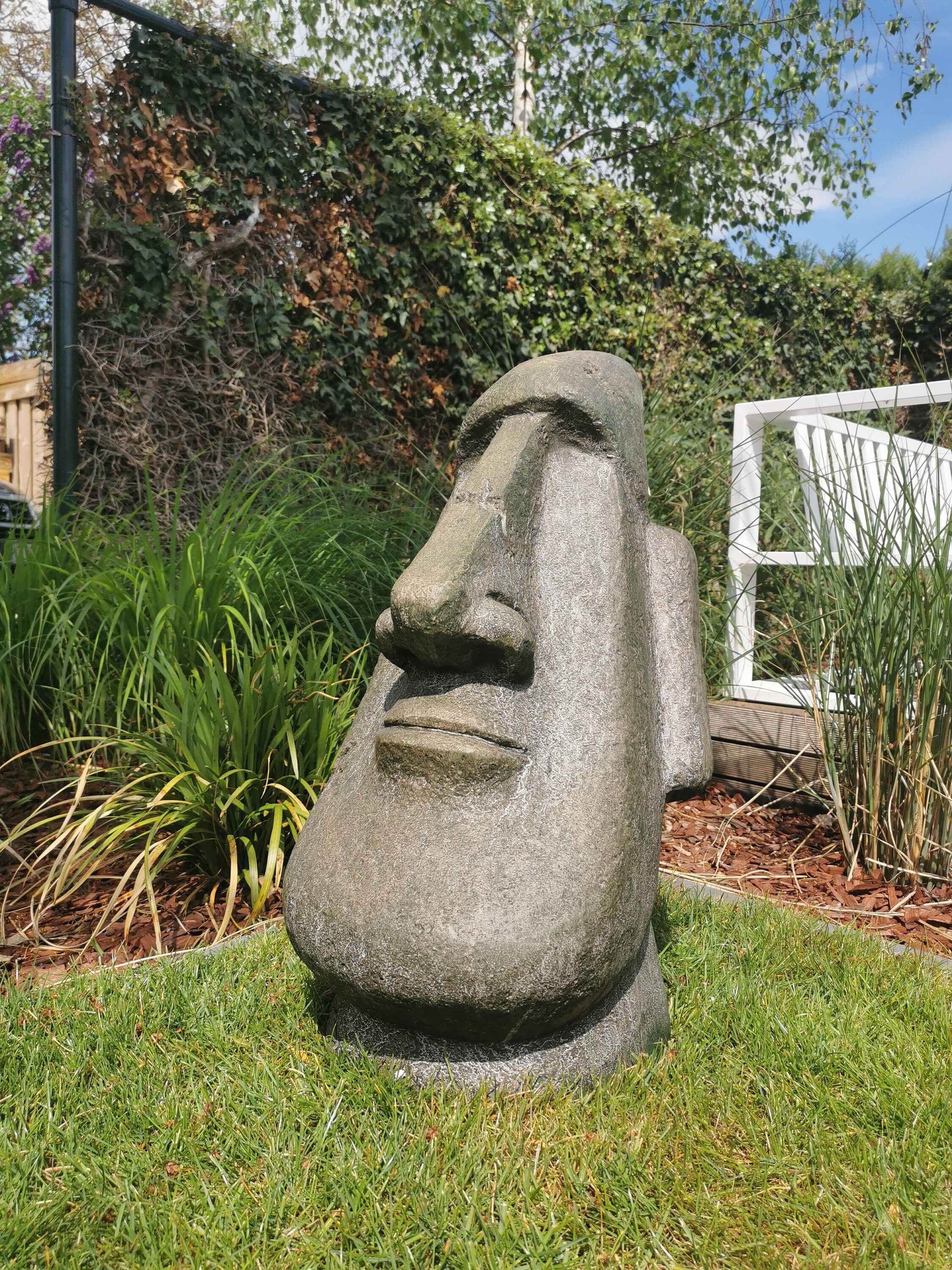 Large garden sculpture of a Moai Easter island rock Garden decor