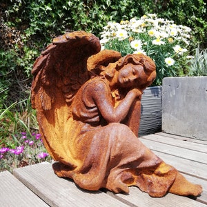 Antique garden sculpture of an Angel - romantic garden decor