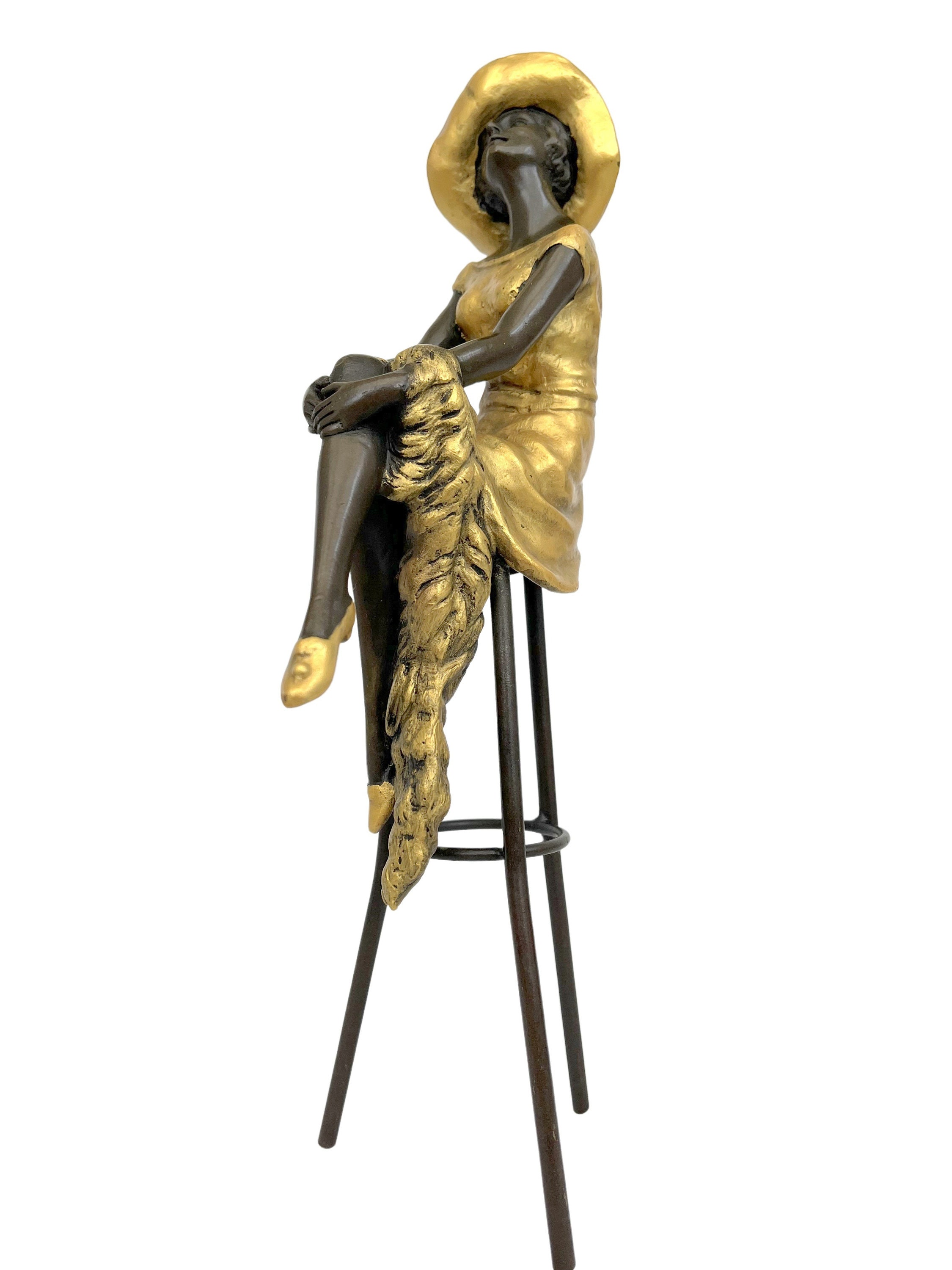 Bronze sculpture of a woman on a bar stool Graceful and elegant bronze figure Decorative
