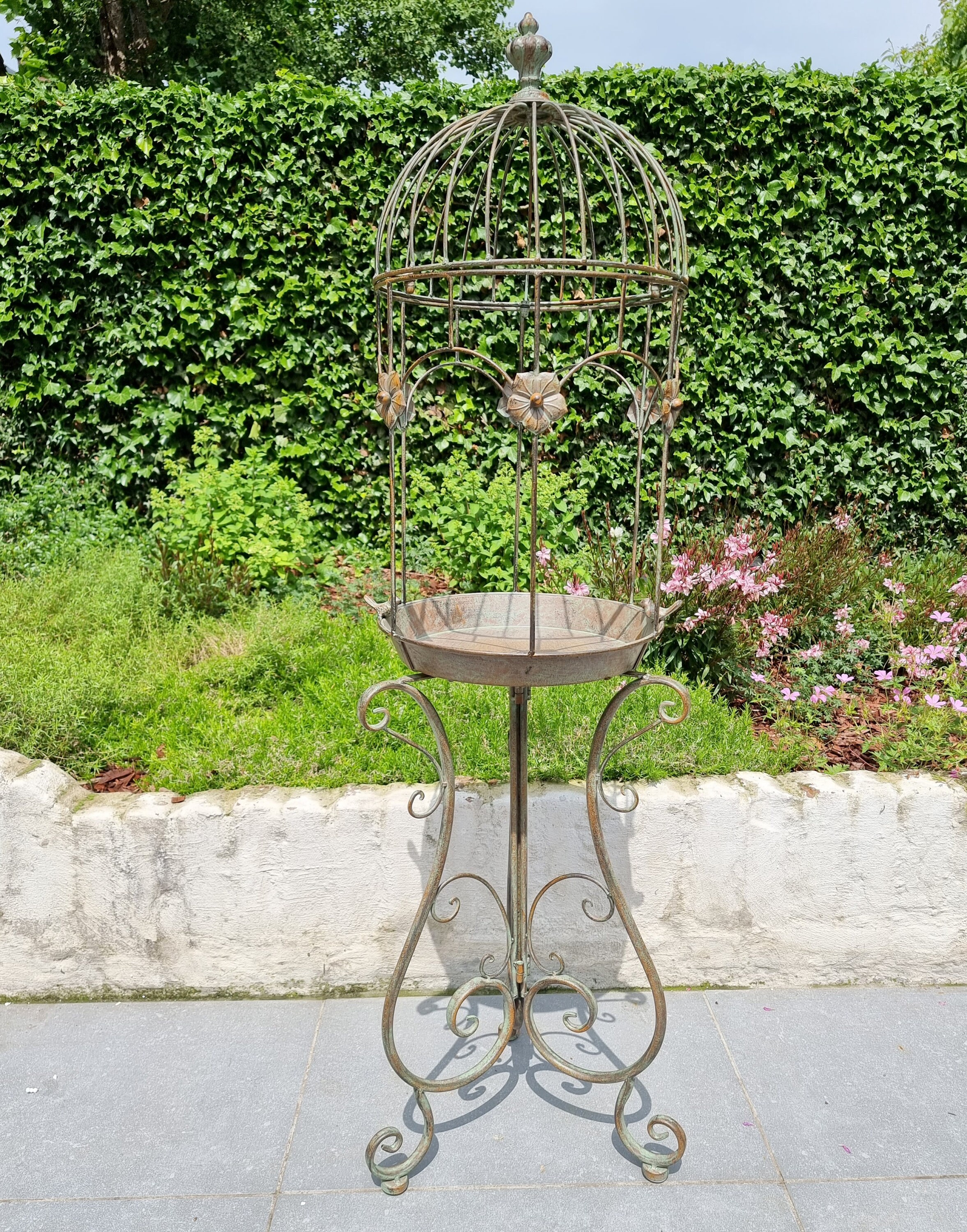 Beautiful large birdbath shaped like an open bird cage Cottage garden