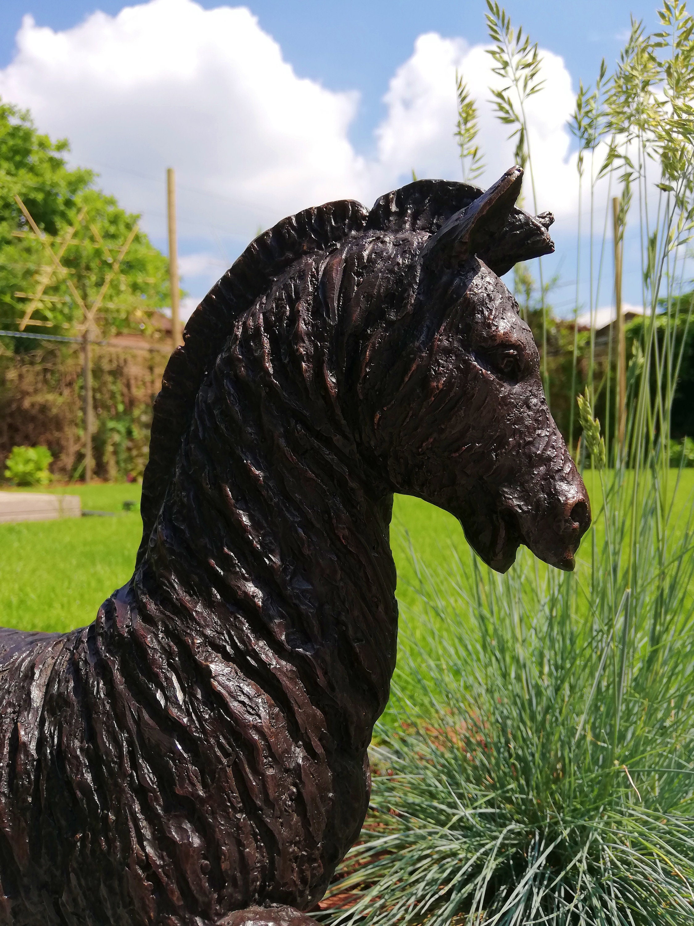 Bronze garden sculpture of a horse