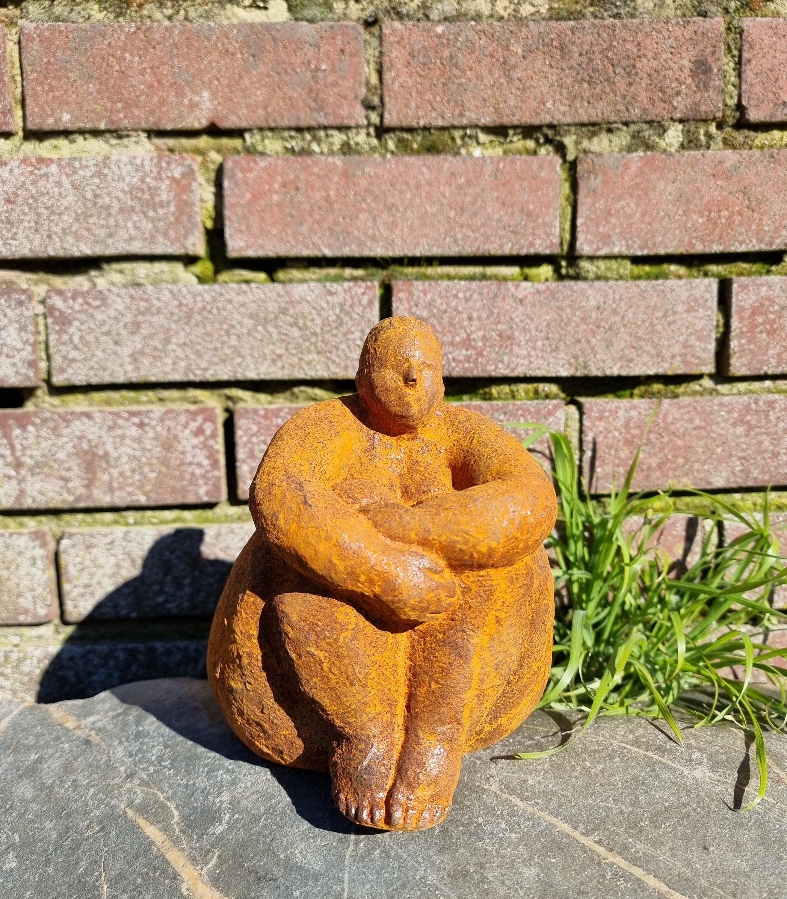 Sculpture of a dreaming lady Garden sculpture