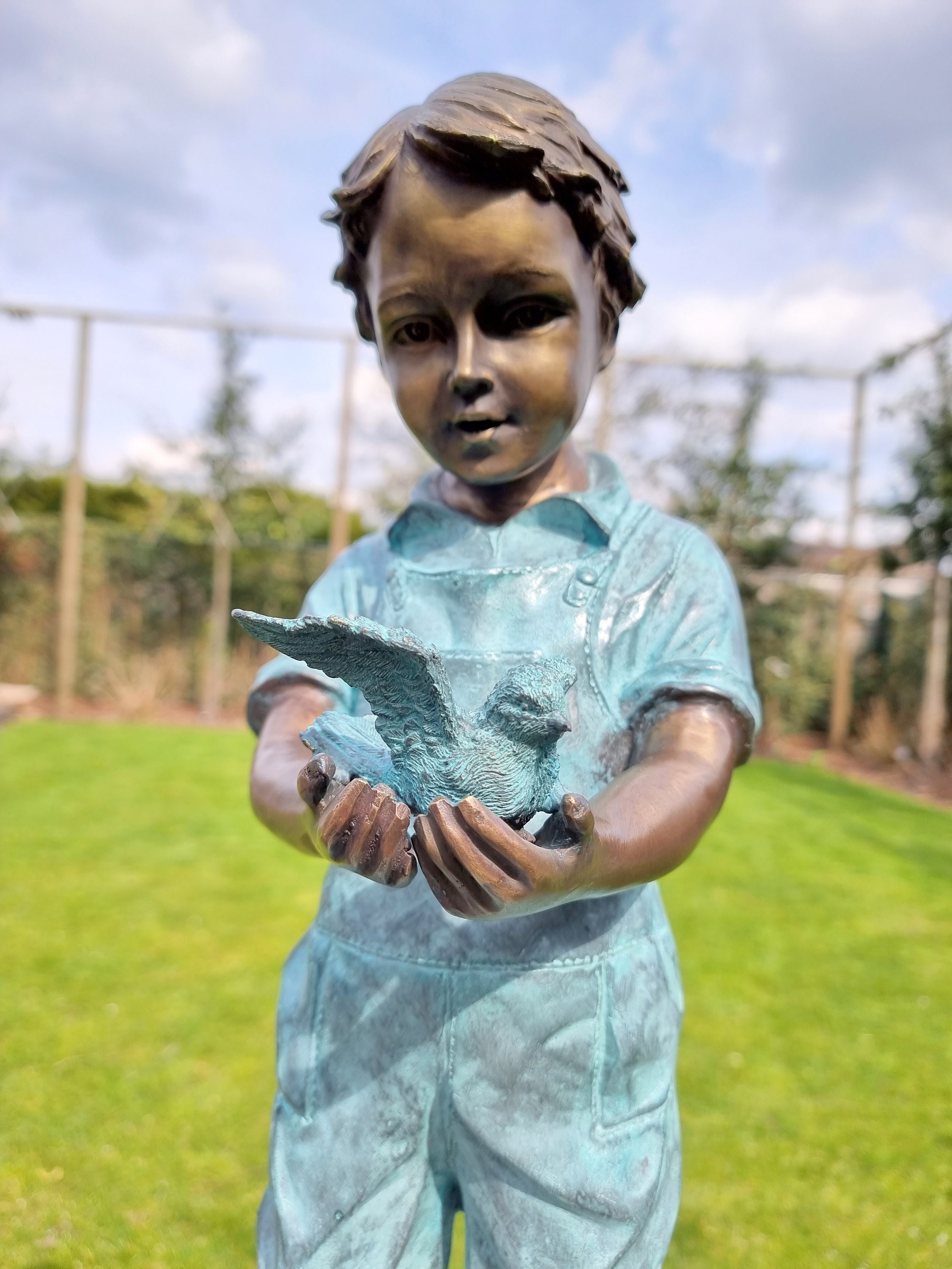 Bronze garden sculpture Boy with bird Bronze children pond sculpture
