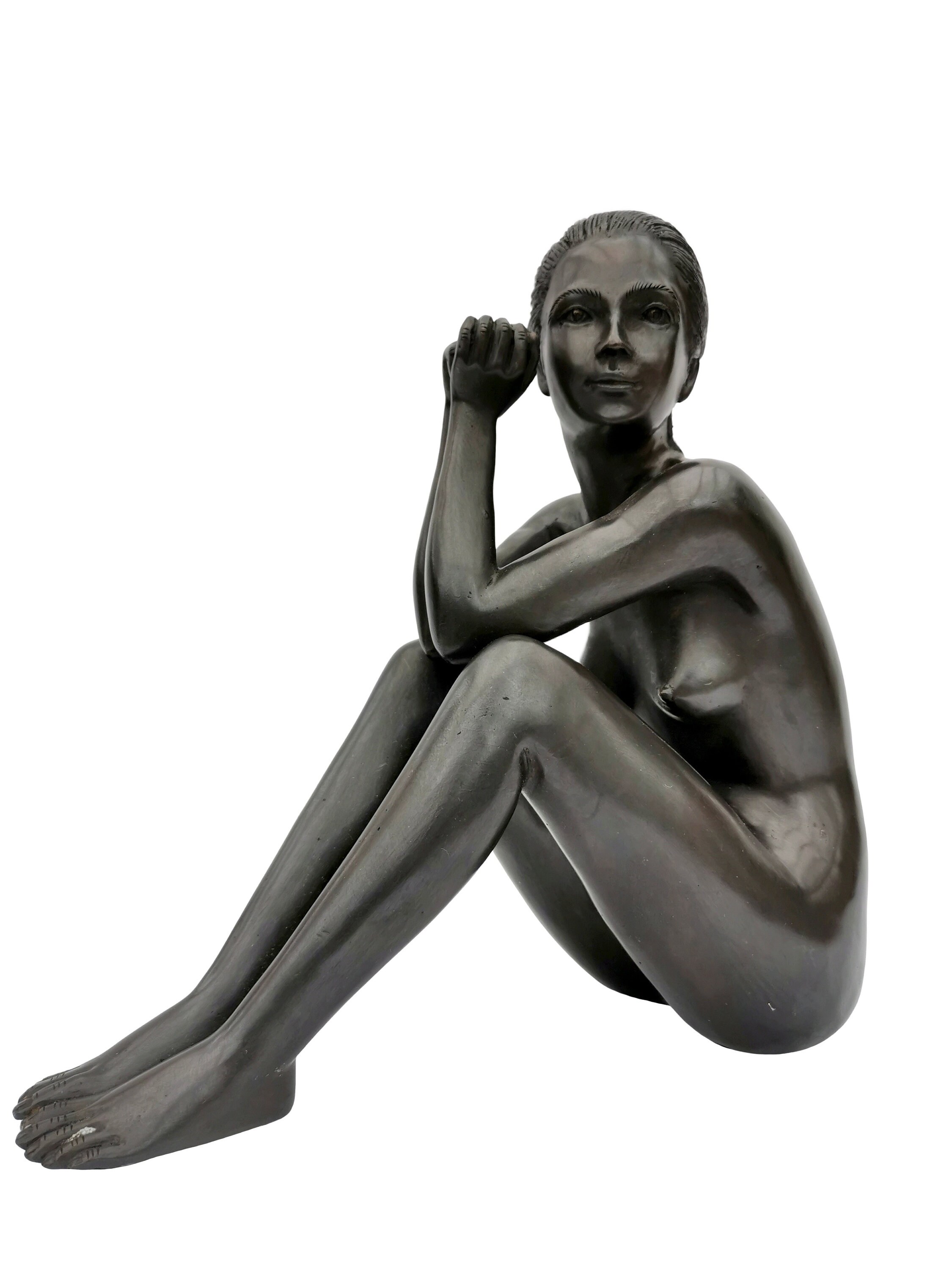 Bronze sculpture of a sitting woman