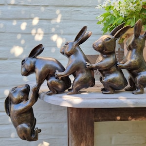 Bronze sculpture of 5 funny rabbits - They rescue a falling rabbit - Bronze home and garden decoration - Bronze gift idea