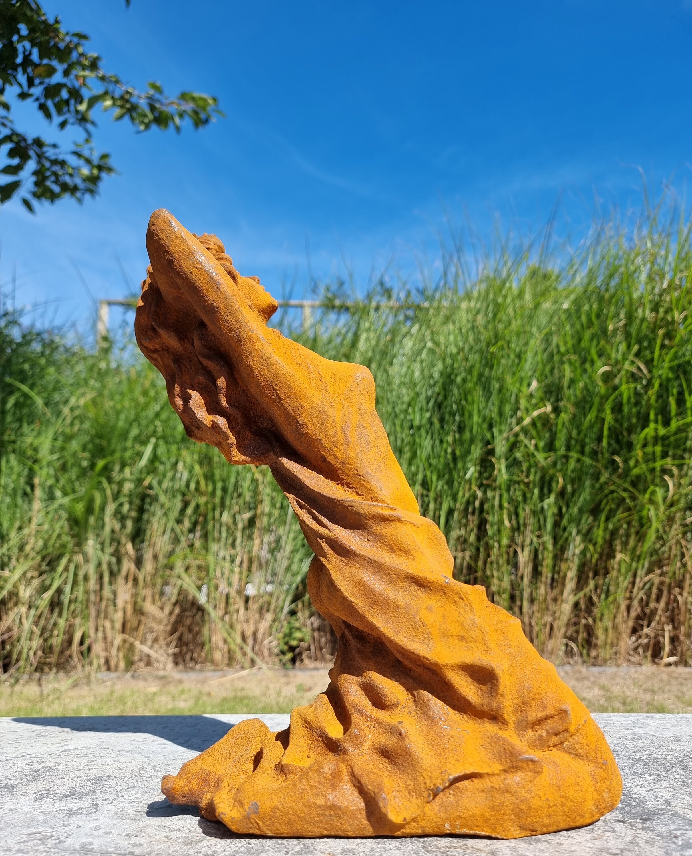 Cast iron garden sculpture of a halfnaked lady Lady sunbathing