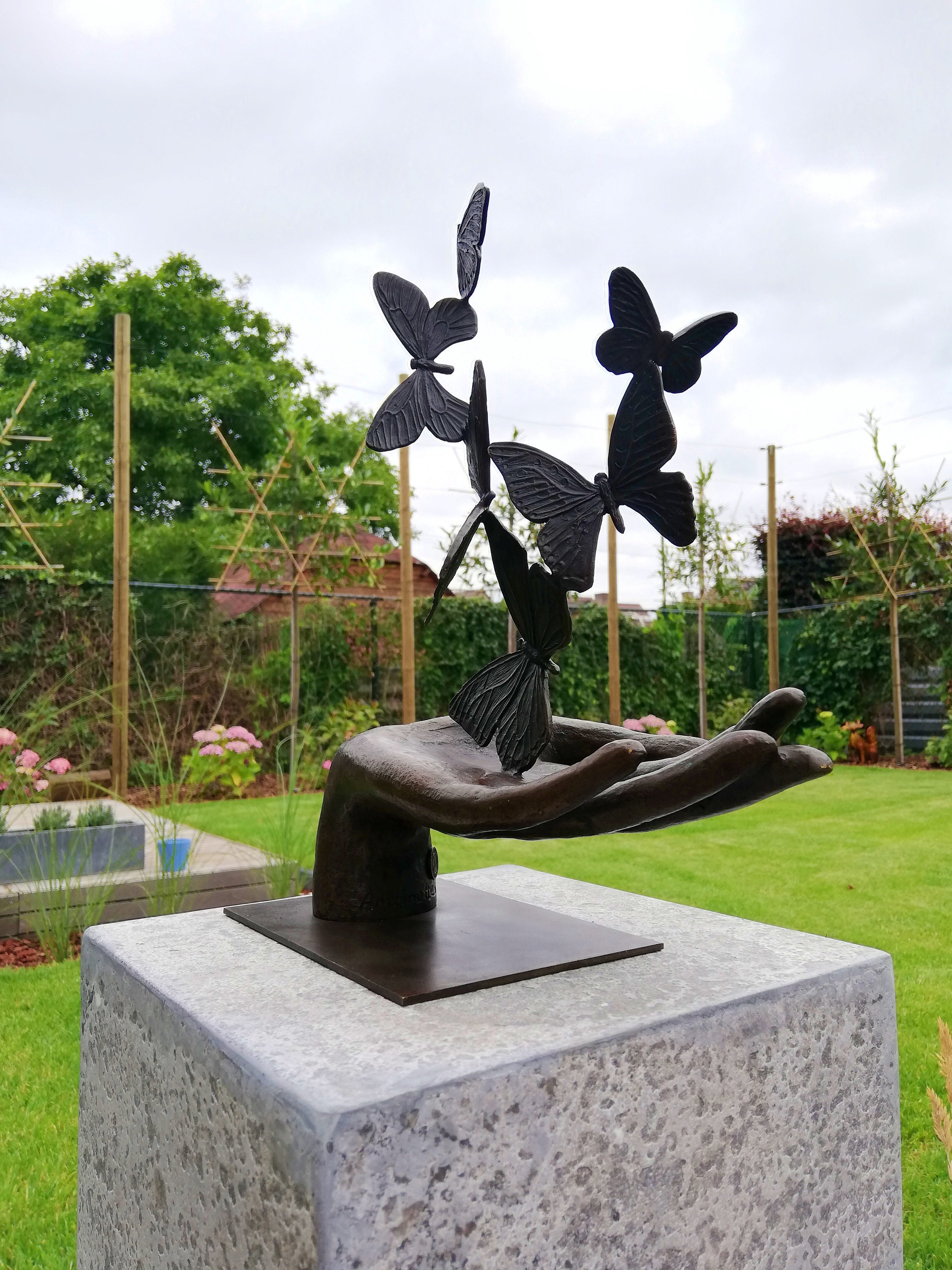 Bronze sculpture releasing butterflies