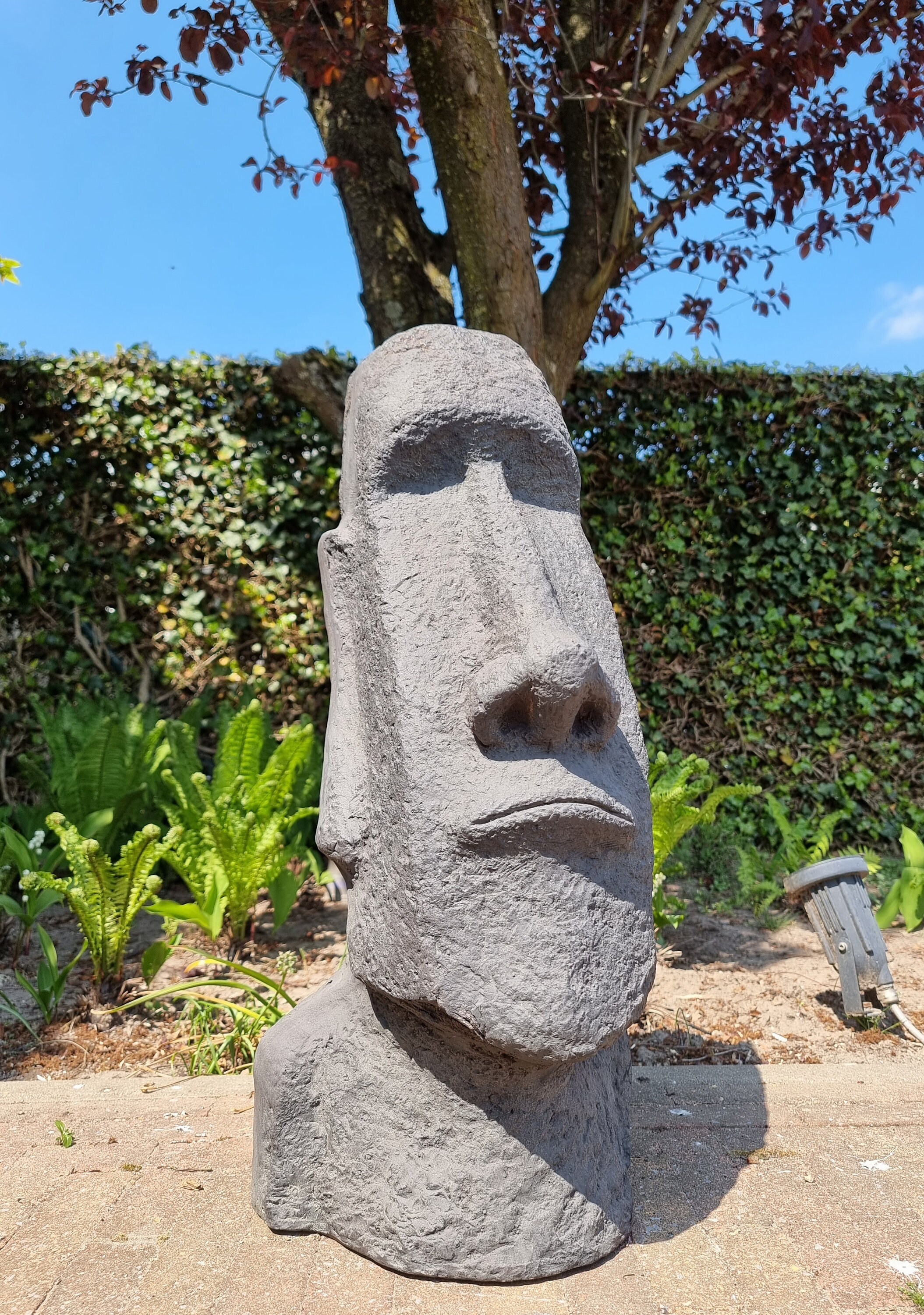 Large garden sculpture of a Moai Easter island rock Garden decor