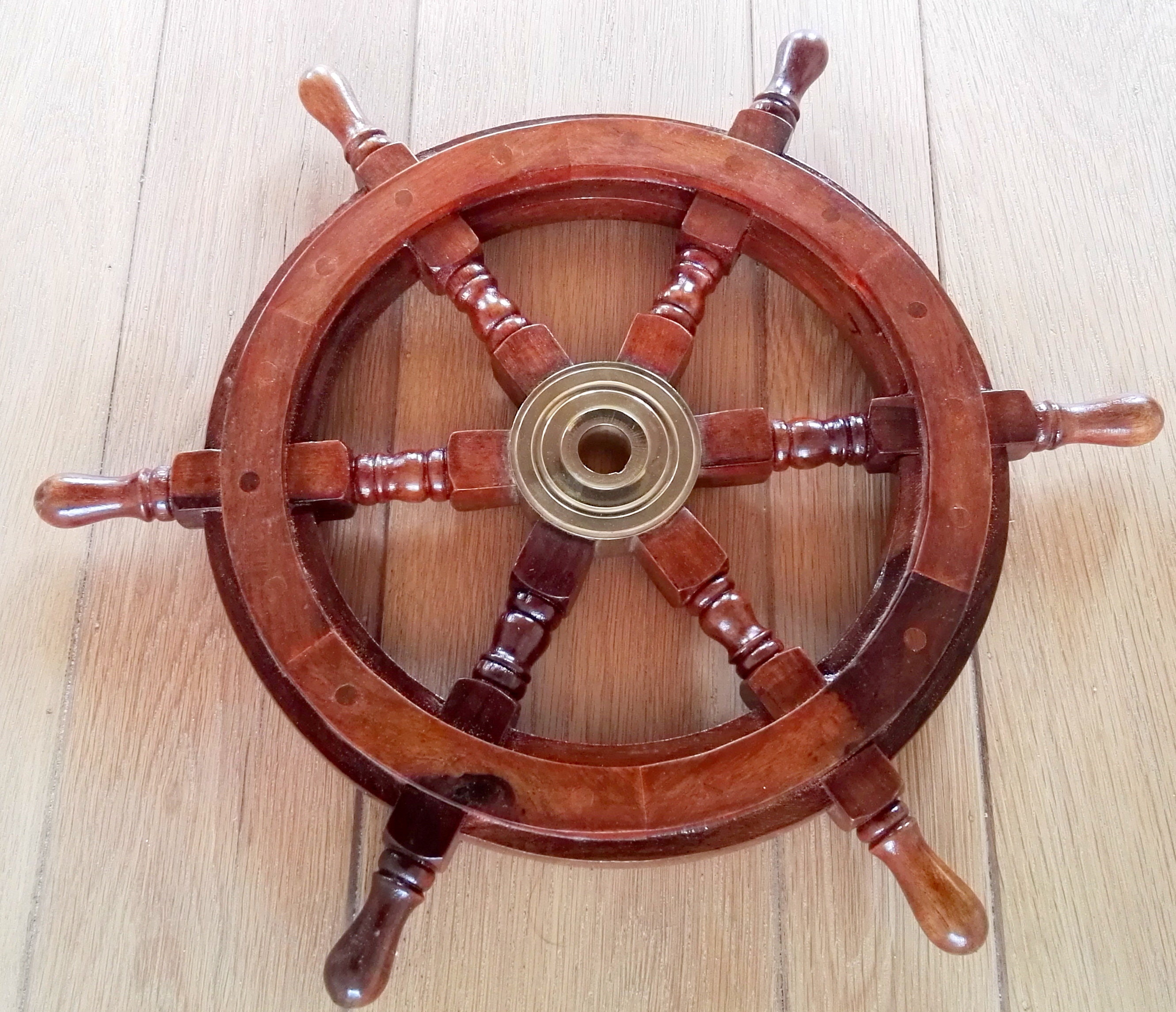 Decorative wooden steering wheel of a boat