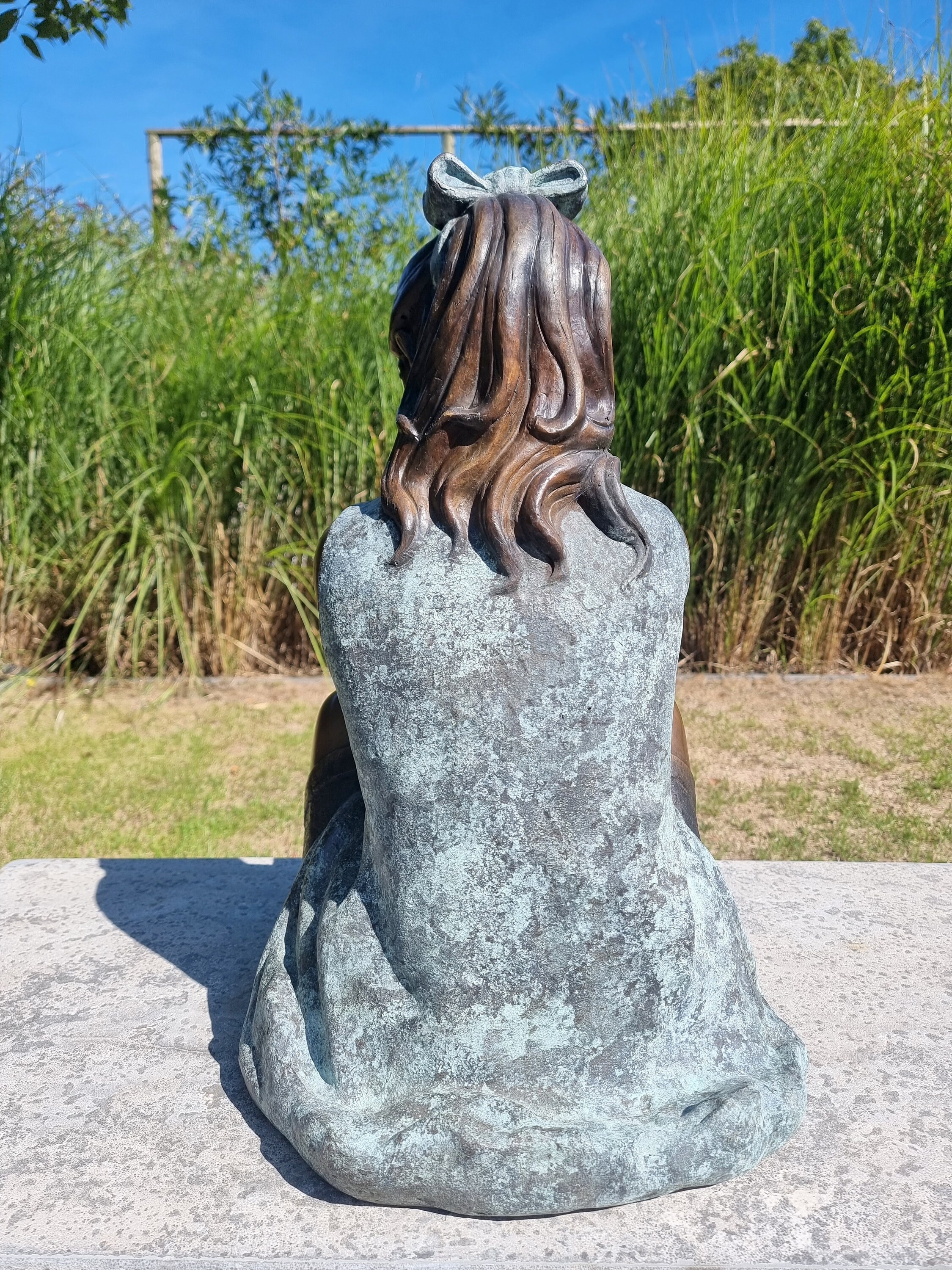 Bronze garden sculpture Girl with bird Bronze children Garden art