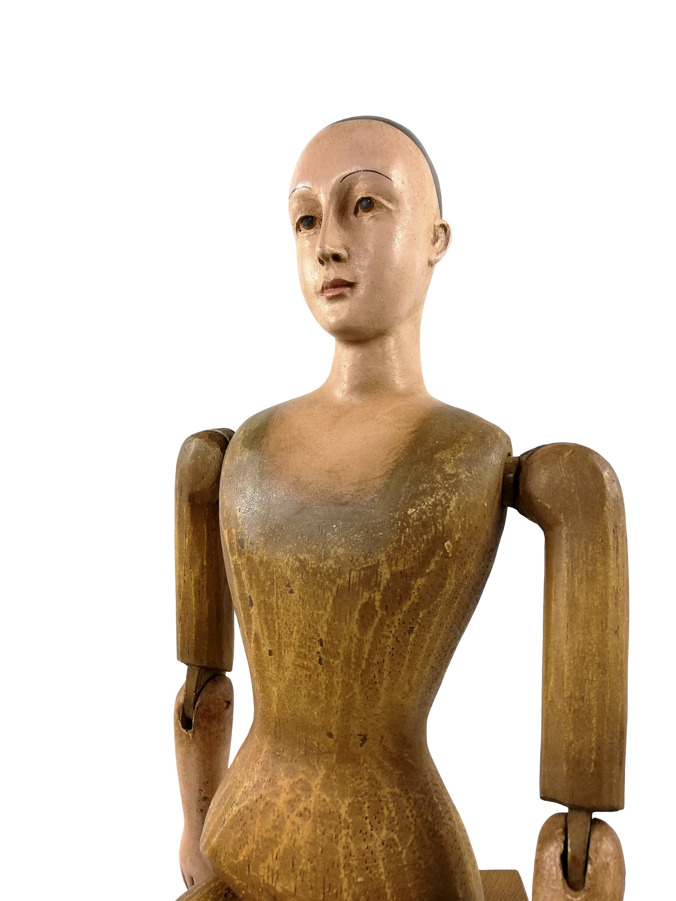 A large wooden mannequin