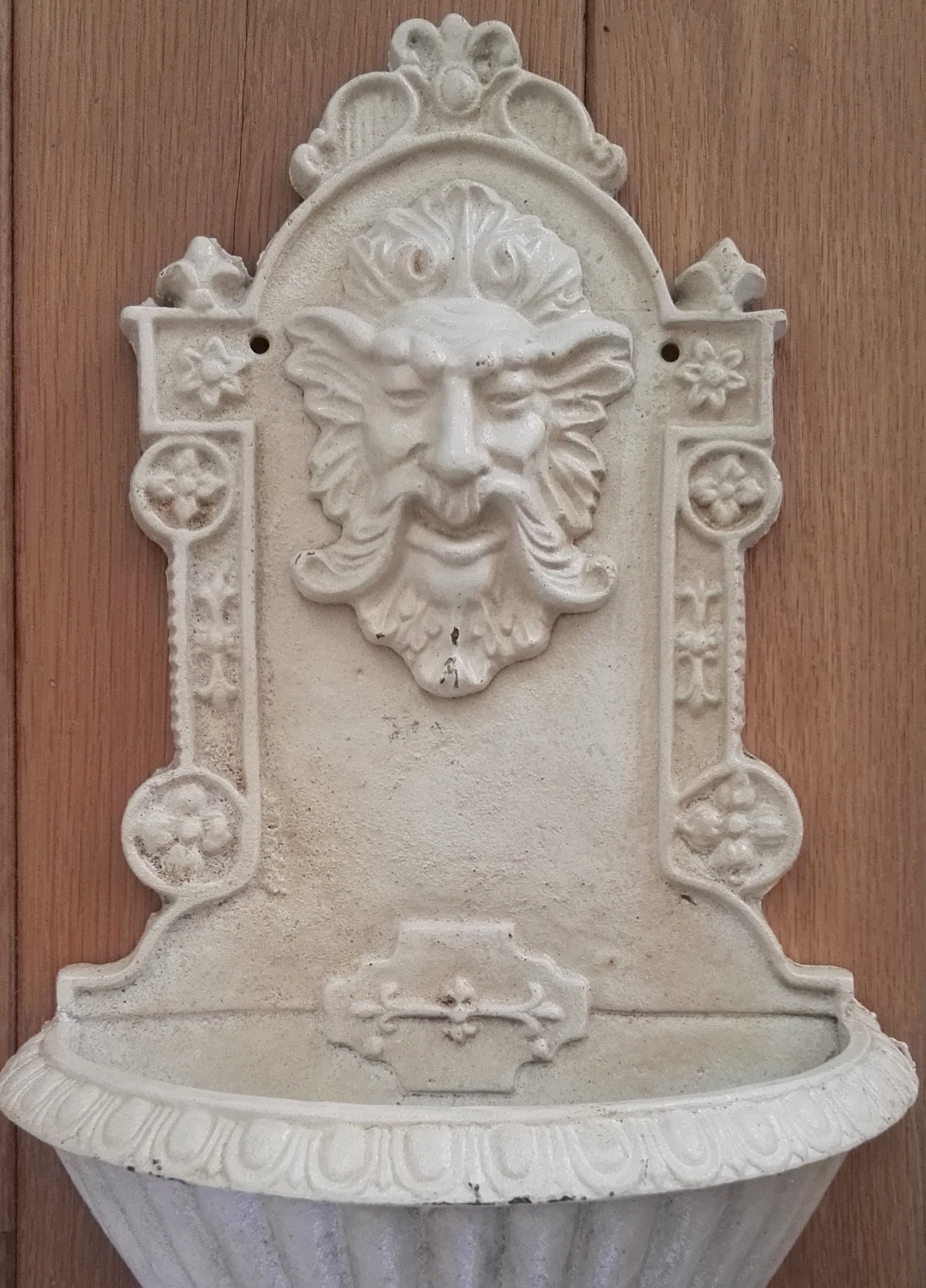 A cast iron wallfountain Vintage style garden decor