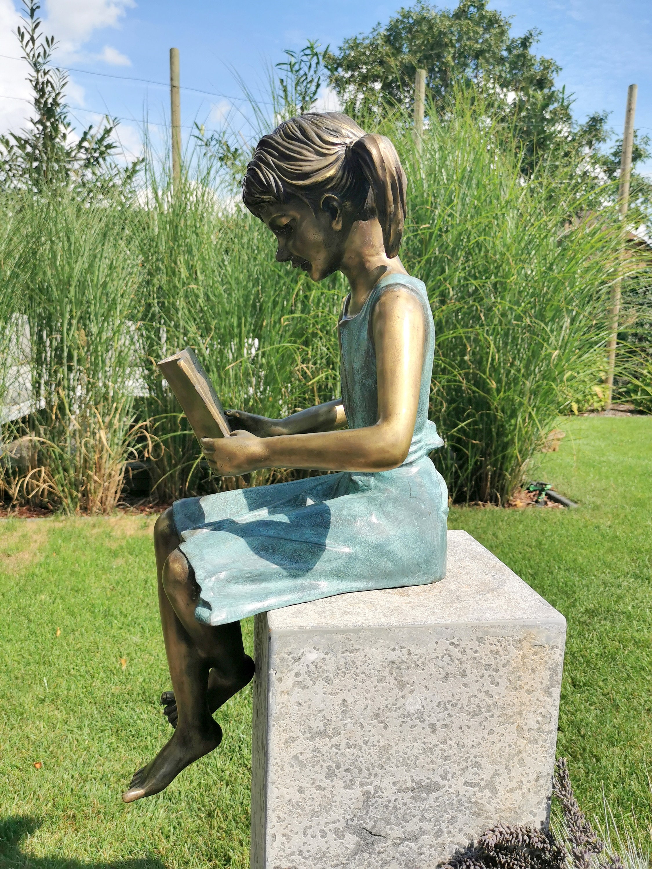 Bronze garden sculpture Girl reading a book Bronze children