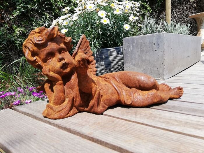 Antique garden sculpture of an Angel (boy)