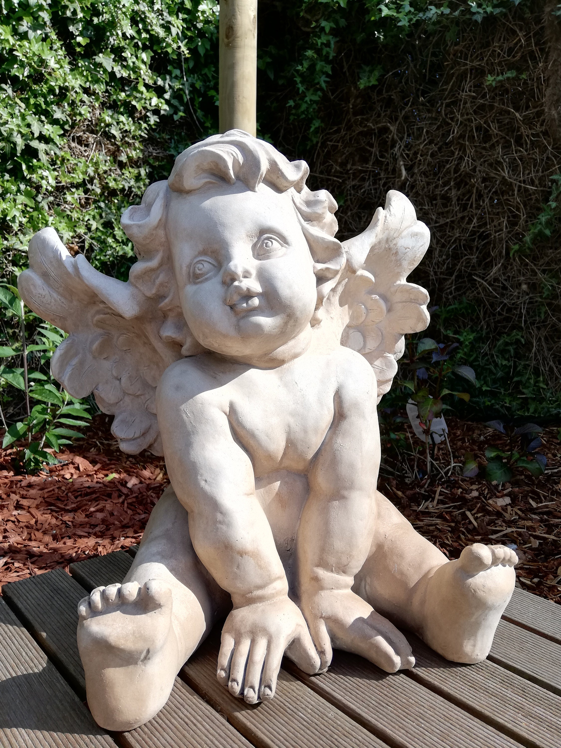 Garden sculpture of an angel / Cherub