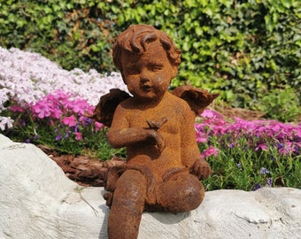 Antique garden sculpture of an Angel (boy) - Sitting model