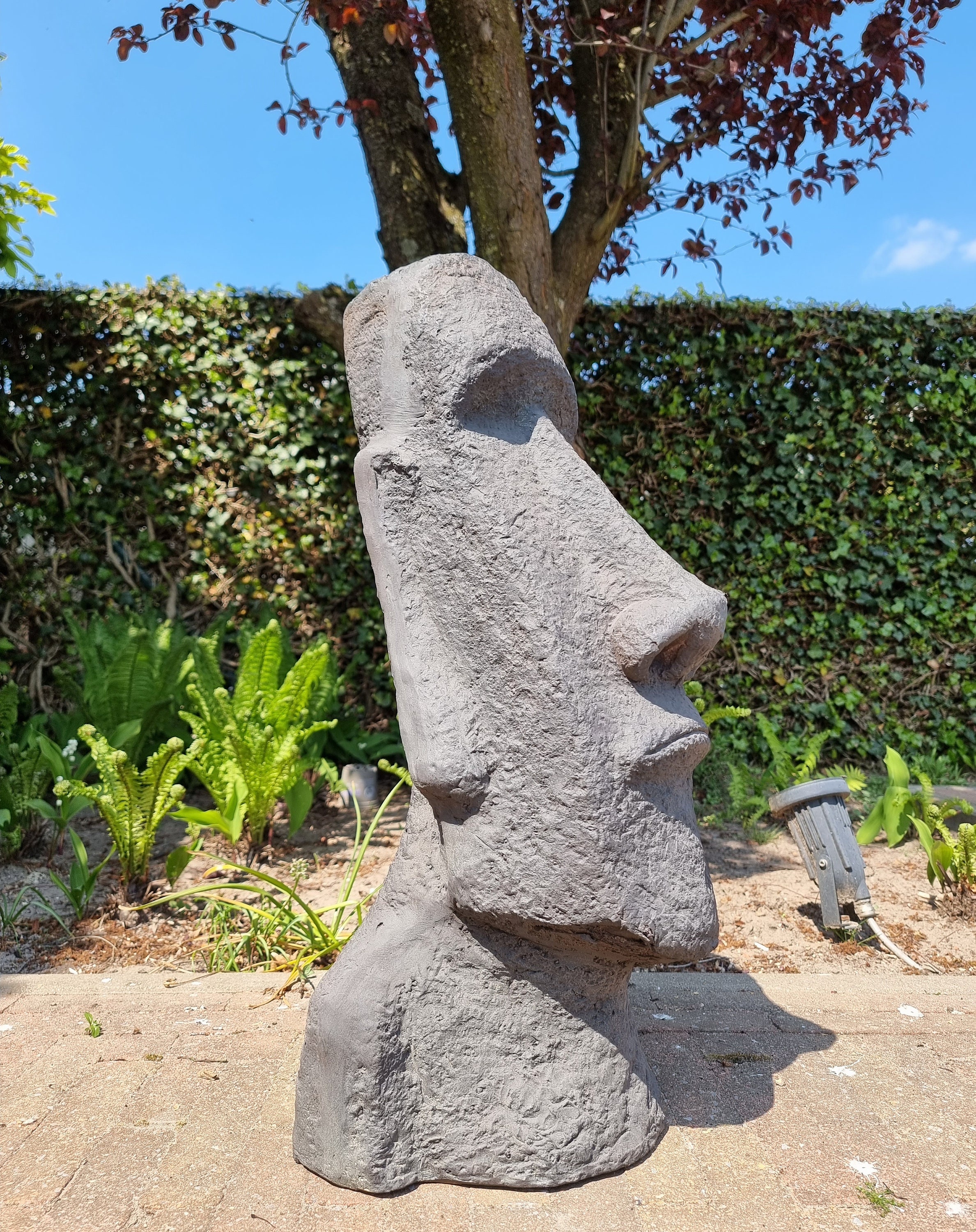 Large garden sculpture of a Moai Easter island rock Garden decor