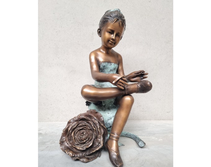 Bronze artwork of a young lady - shoe tying - Rose - Bronze garden art children