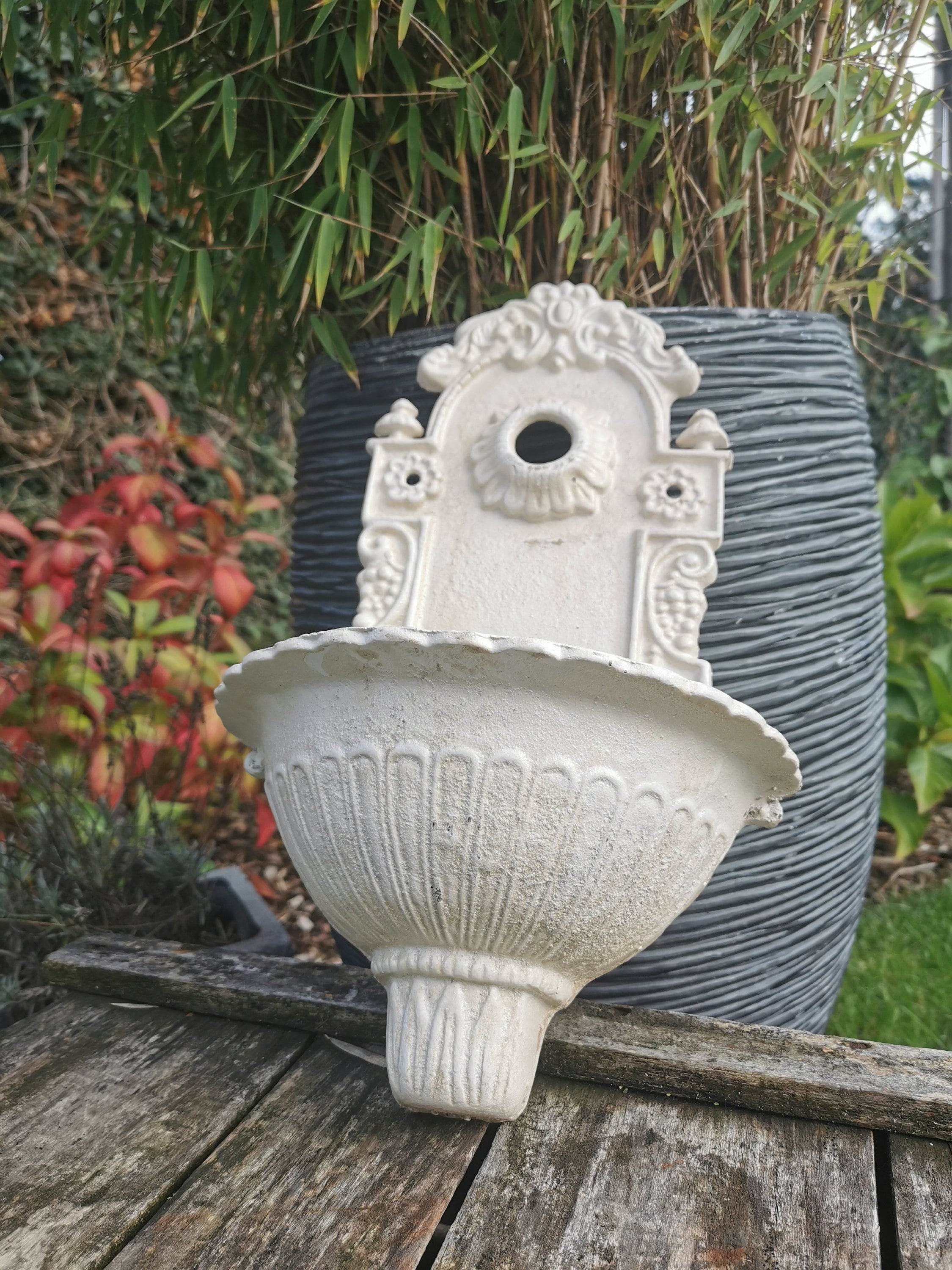 A cast iron wallfountain