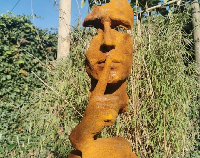 Garden sculpture of a man who asks for silence - The whispering man