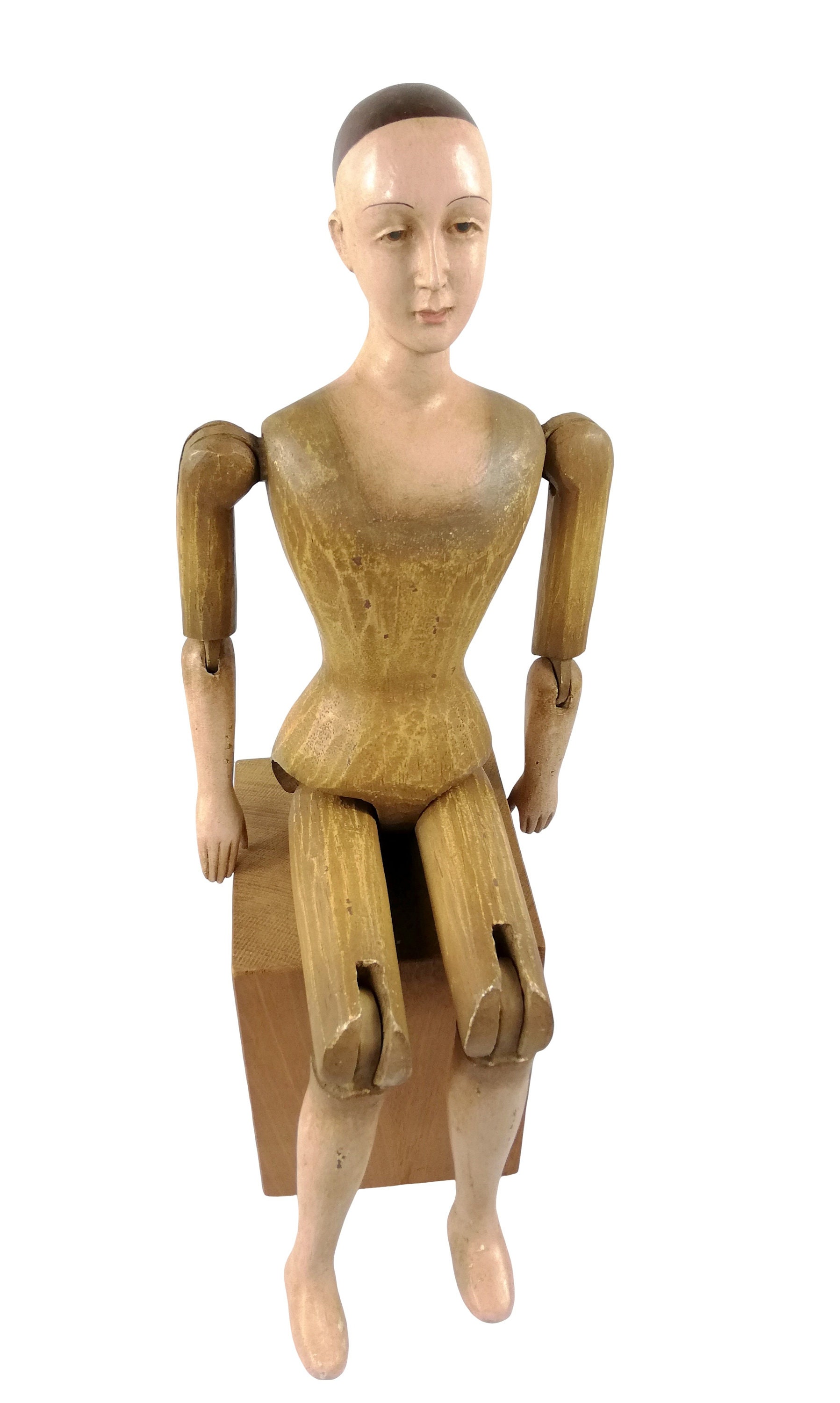 A large wooden mannequin