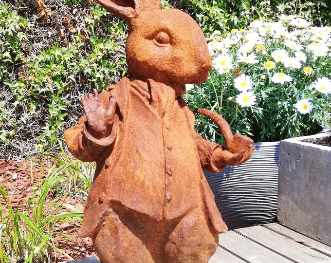 Cast iron hare smoking the pipe - English cottage garden