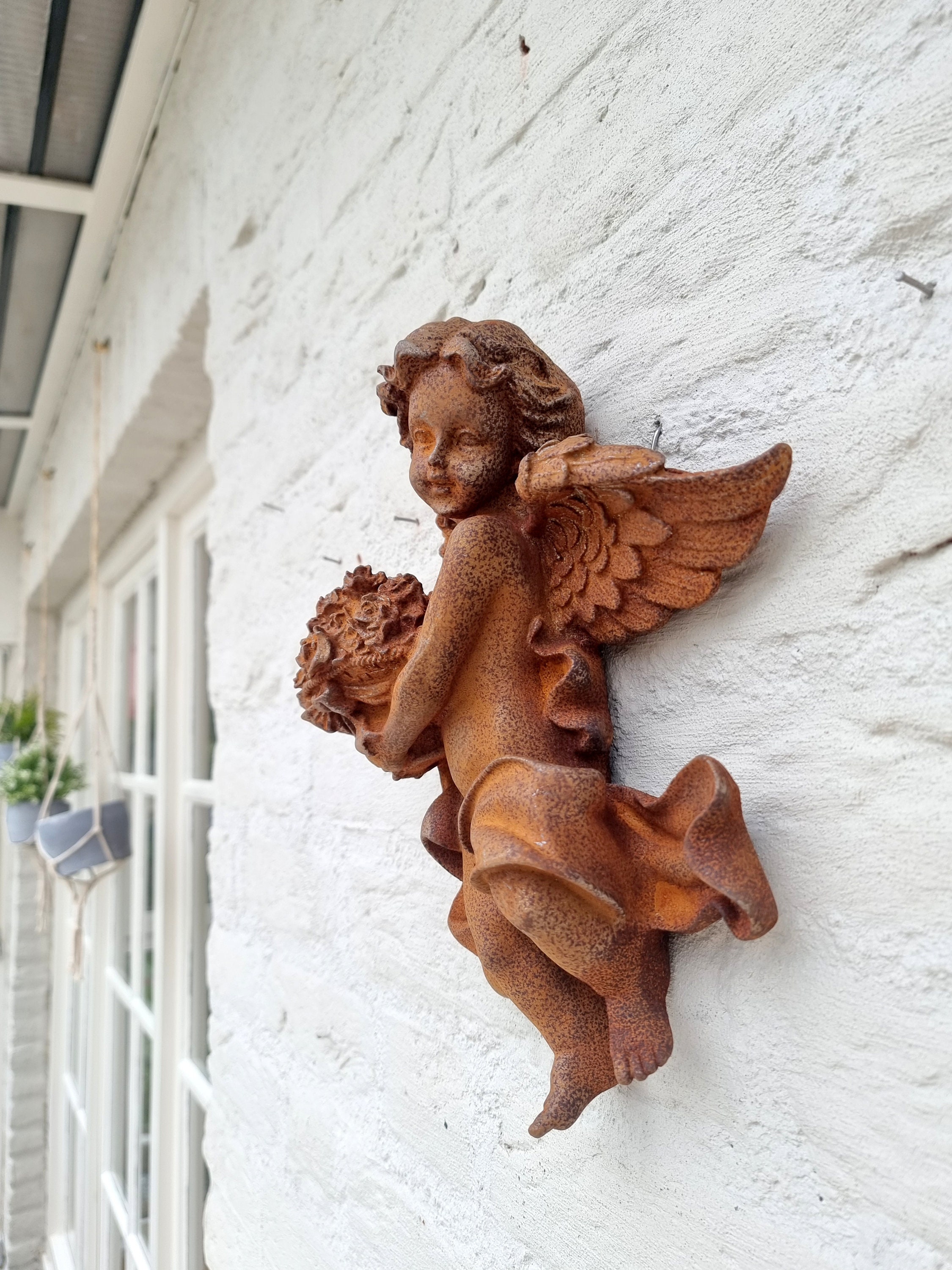 Cast iron wall sculpture of an Angel Cherub Christmas wall