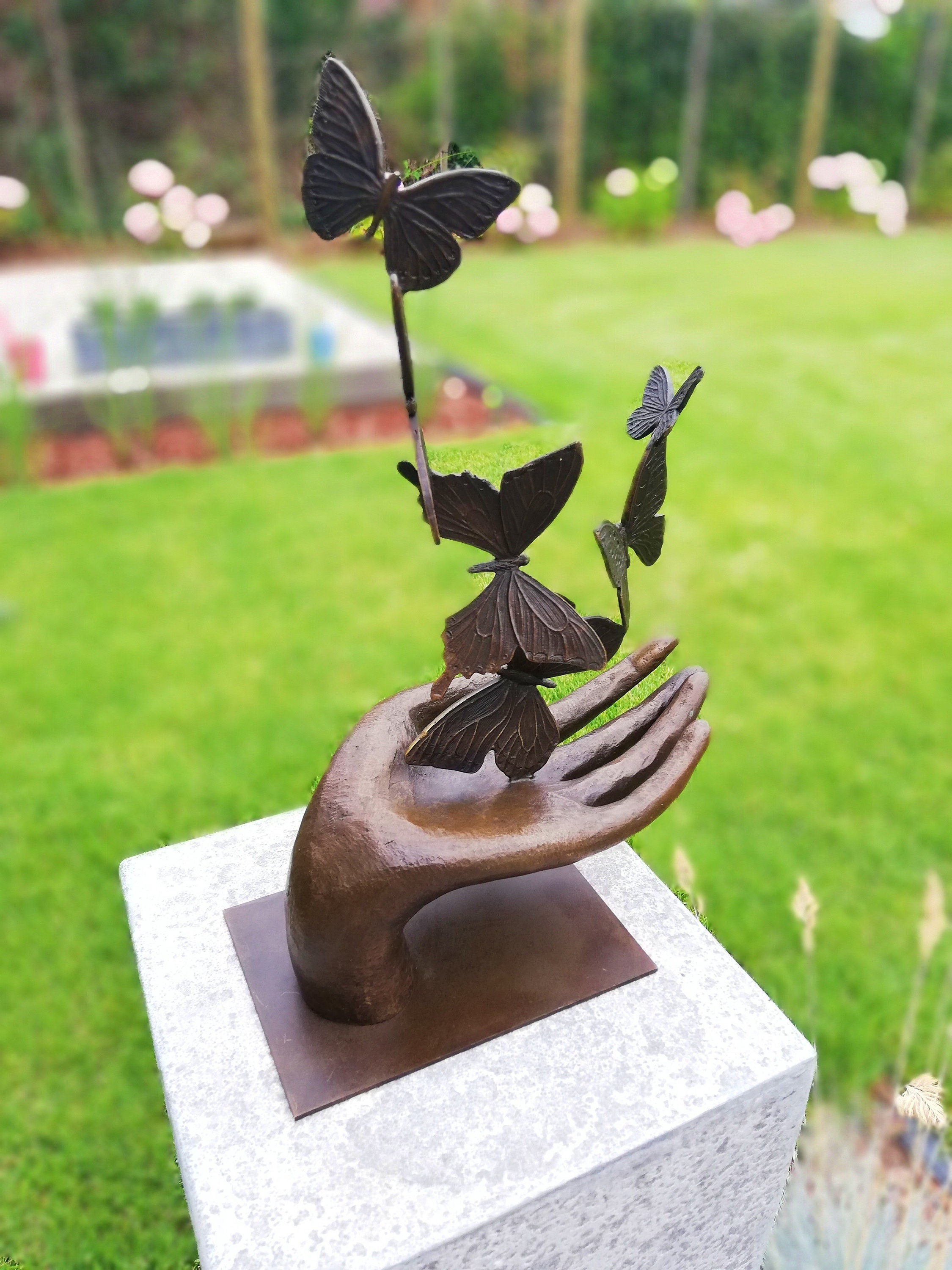 Bronze sculpture releasing butterflies