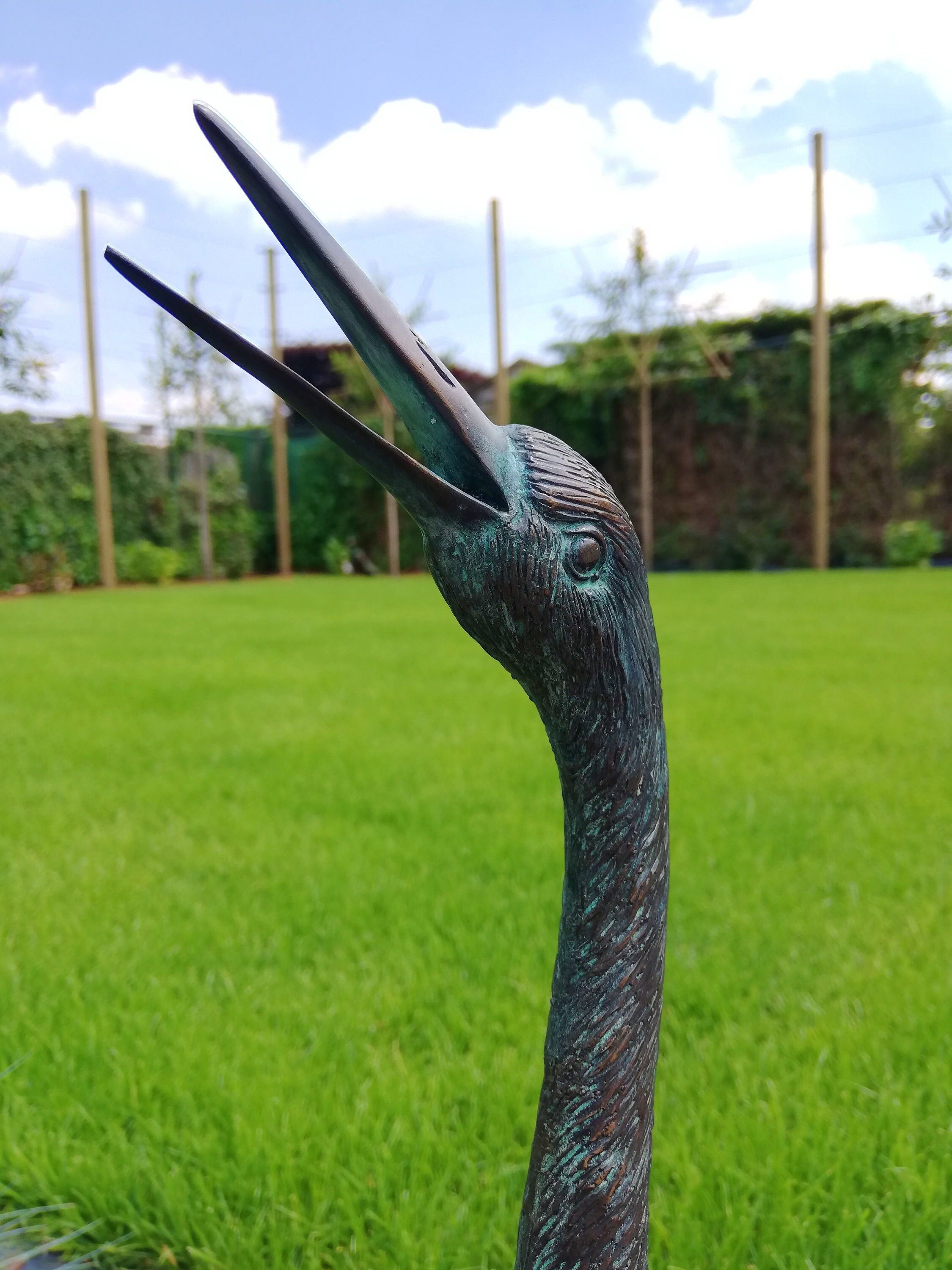 Bronze garden sculpture of a heron