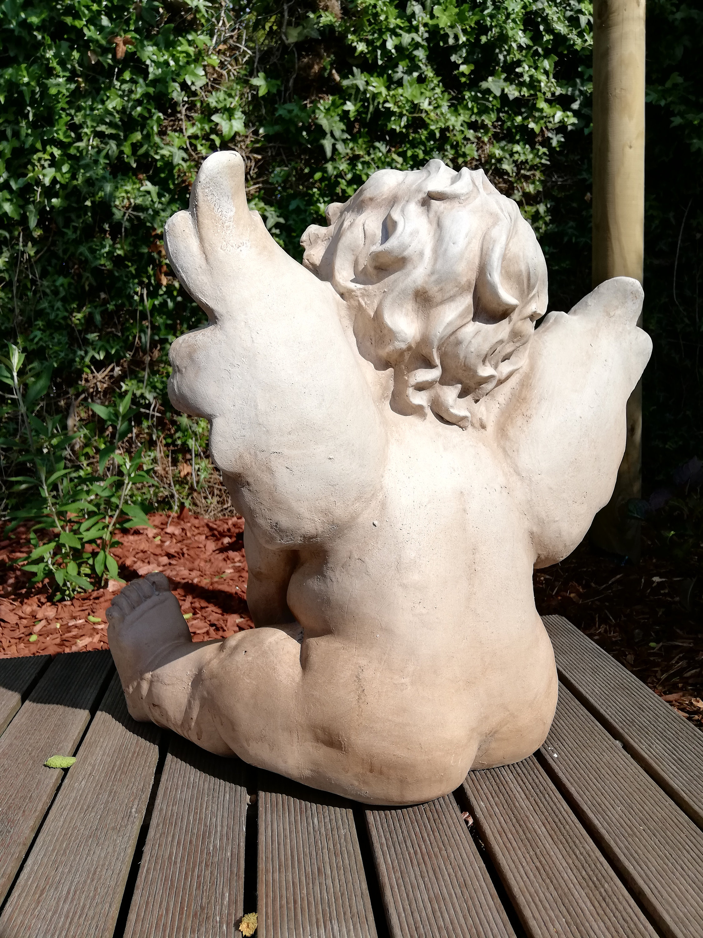 Garden sculpture of an angel / Cherub