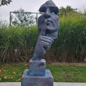 Large abstract sculpture of a male 'whispering' - garden art