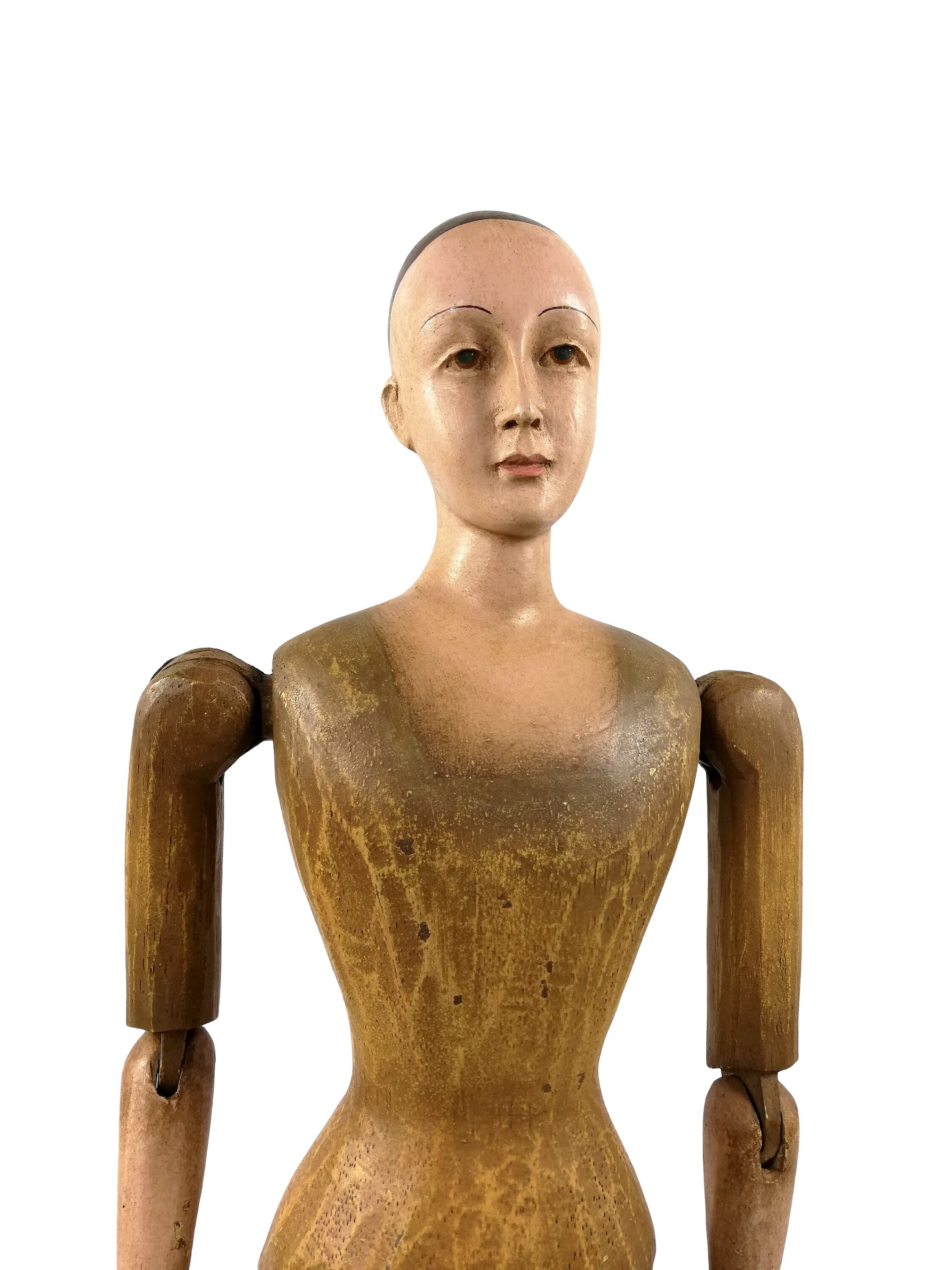 A large wooden mannequin