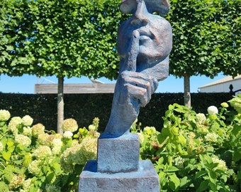 Large abstract sculpture of a male 'whispering' - garden art