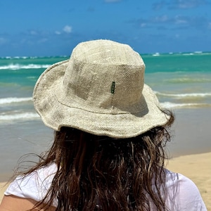 Women wearing handmade hemp natural solid sun hat.