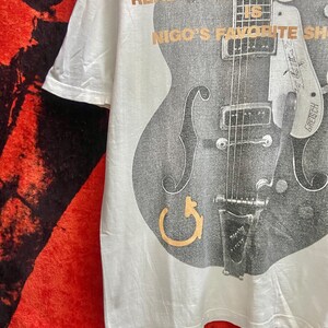 Puede incluir: Una taza de cer&aacute;mica blanca con asa negra y el texto "But First, Coffee" en estilo manuscrito. La taza puede contener aproximadamente 325-440 ml de l&iacute;quido.