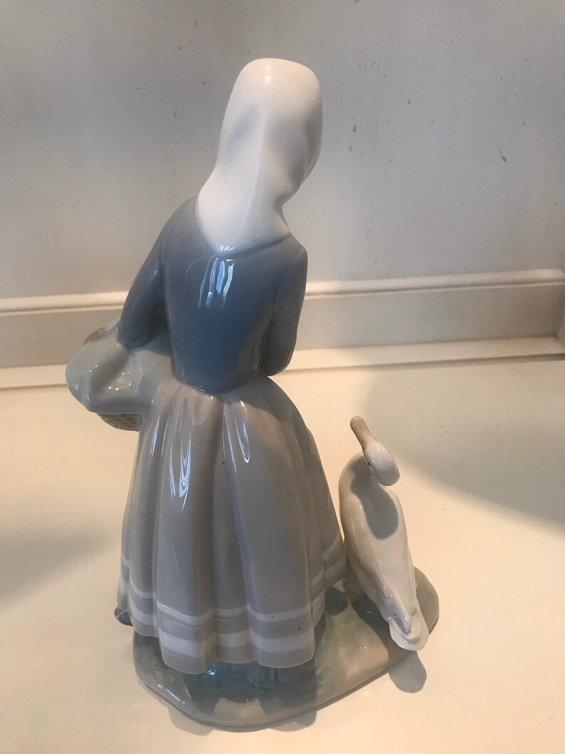 lladro shepherdess with ducks