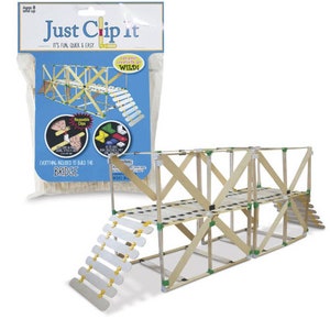 May include: A wooden bridge building kit with the text "Just Clip It". The kit includes wooden sticks, white and yellow clips, and a bridge structure. The bridge has a double-decker design with a staircase.