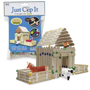 May include: A children's craft kit labeled "Just Clip It" to build a barnyard house. The kit includes wooden sticks, clips, and plastic animal figures. The barnyard house is made of wooden sticks and features a horse, sheep, and rooster.