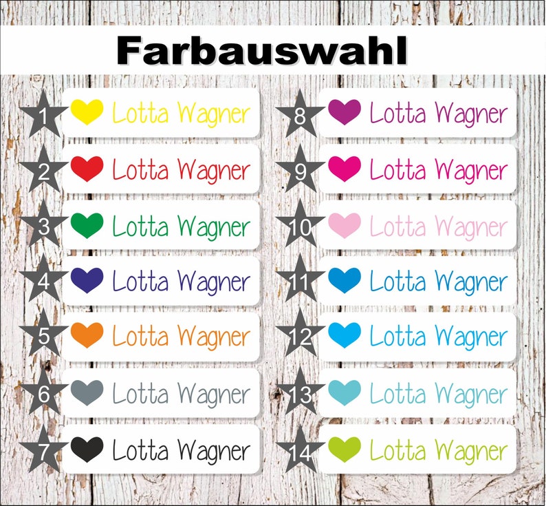 May include: A set of 14 iron-on labels with a white background and a black star in the top left corner. Each label has a different coloured heart in the top right corner and the text "Lotta Wagner" in black. The colours of the hearts are yellow, red, green, blue, orange, grey, black, purple, pink, light blue, dark blue, turquoise, and green.