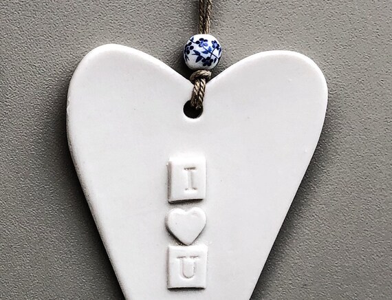 IRELAND FINE PORCELAIN CERAMIC HANGING ORNAMENT HEART HOME IS WHERE THE HEART IS IRELAND FINE PORCELAIN CERAMIC HANGING ORNAMENT HEART HOME IS WHERE THE HEART IS