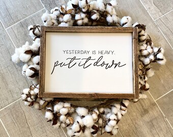 Yesterday is heavy put it down. hand painted sign, wooden framed sign